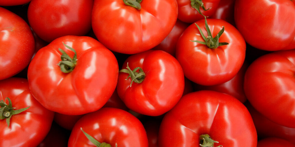A pile of bright red tomatoes. 